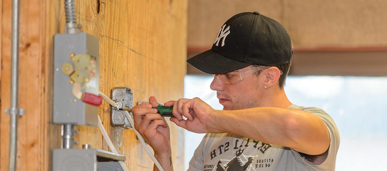 Student working on an electrical board